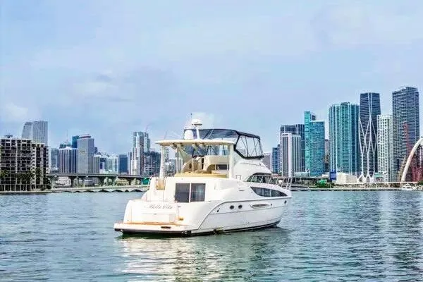 Slide: The Image of 2007 Meridian 459 Motoryacht on clear water, aerial view. - 2