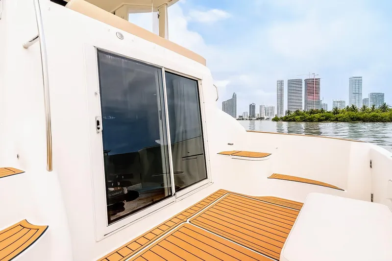 Slide: The Image of 2007 Meridian 459 Motoryacht cabin with open door and wooden deck. - 22