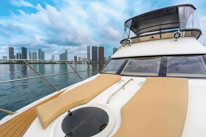 Slide: The Image of 2007 Meridian 459 Motoryacht with sun pads, cruising on a clear day. - 26