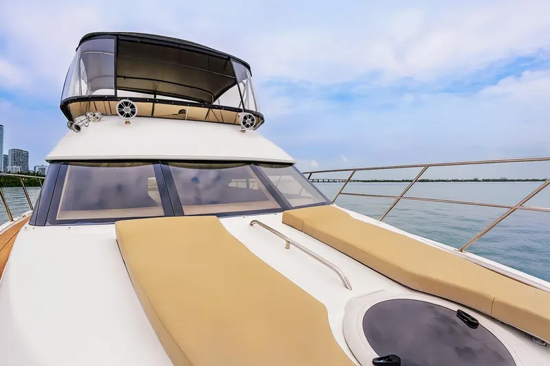 Slide: The Image of 2007 Meridian 459 Motoryacht deck with seating, stairs, and ocean view. - 28