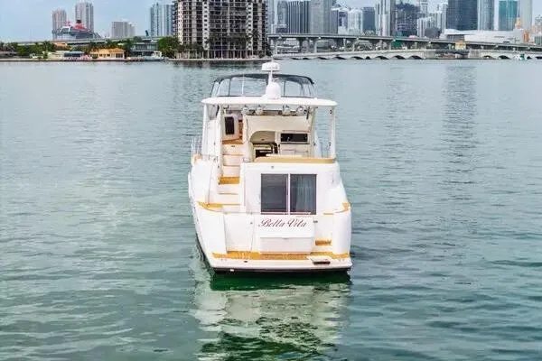 Slide: The Image of 2007 Meridian 459 Motoryacht cruising near city skyline and palm trees. - 9