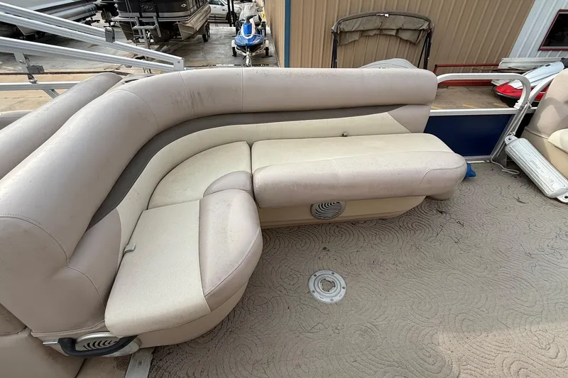 Slide: The Image of 2014 Sun Tracker Party Barge 22 DLX with beige seating and textured flooring. - 10
