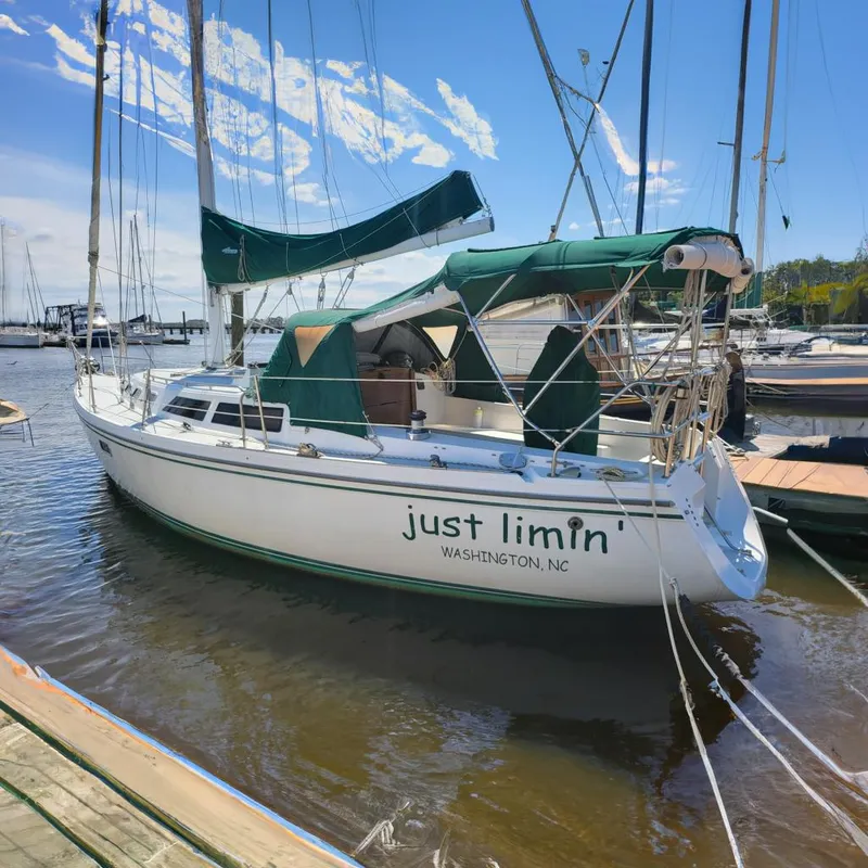 The Image of Catalina 34 sailboat, 1993 model, docked in Washington, NC, with green canopy. - 0