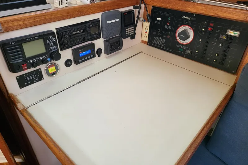 Slide: The Image of Navigation and control panel of a 1993 Catalina 34 sailboat, featuring various instruments. - 6