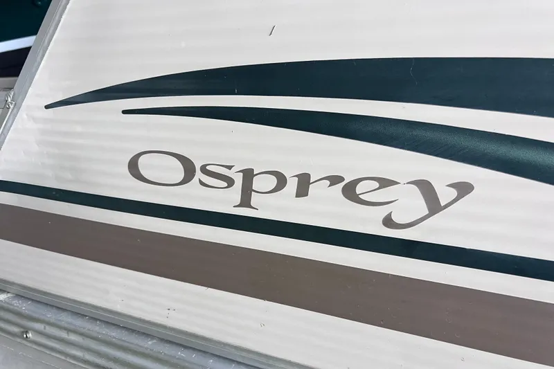 Slide: The Image of 2006 Manitou 24 Osprey boat deck with cleat and navigation light. - 4