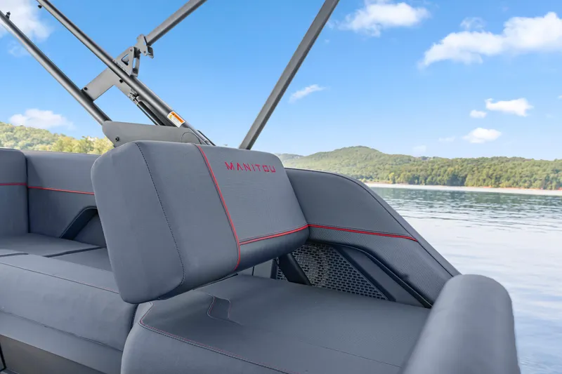 Slide: The Image of 2024 Manitou 22 Explore Max Bench boat interior with lake view. - 9