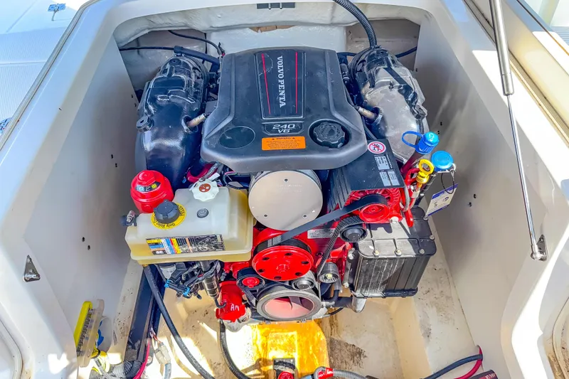 Slide: The Image of Engine compartment of 2021 Chaparral 237 SSX boat, featuring Volvo Penta 240 V6 engine. - 13