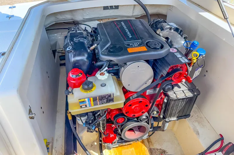 Slide: The Image of Engine compartment of 2021 Chaparral 237 SSX boat, featuring a Volvo Penta engine. - 15