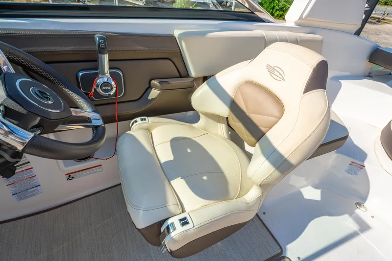 Slide: The Image of 2021 Chaparral 237 SSX boat interior with steering wheel and luxurious seating. - 20