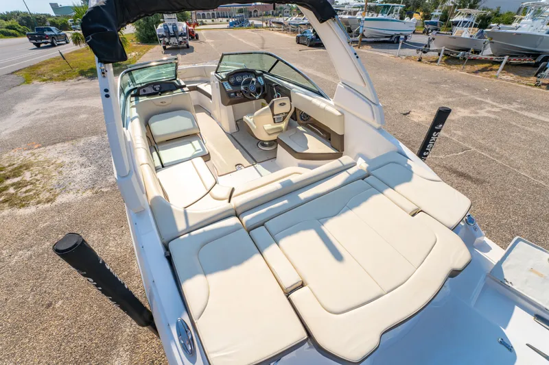 Slide: The Image of 2021 Chaparral 237 SSX boat interior with spacious seating and modern dashboard. - 28