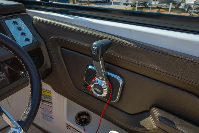 Slide: The Image of 2021 Chaparral 237 SSX boat throttle control and steering wheel detail. - 29