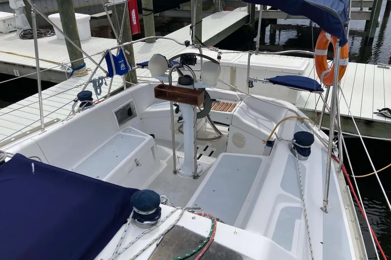 Slide: The Image of Cockpit of a 1993 Hunter 33.5 sailboat docked at a marina. - 10