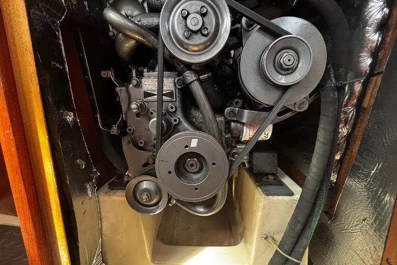 Slide: The Image of Engine compartment of a 1993 Hunter 33.5 sailboat, showing belts and pulleys. - 30