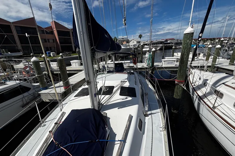 Slide: The Image of Sailboat docked at marina, Hunter 33.5 model, 1993, under clear blue sky. - 5