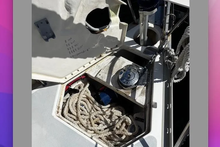 Slide: The Image of Open hatch on 1993 Hunter 33.5 sailboat showing ropes and winch. - 7