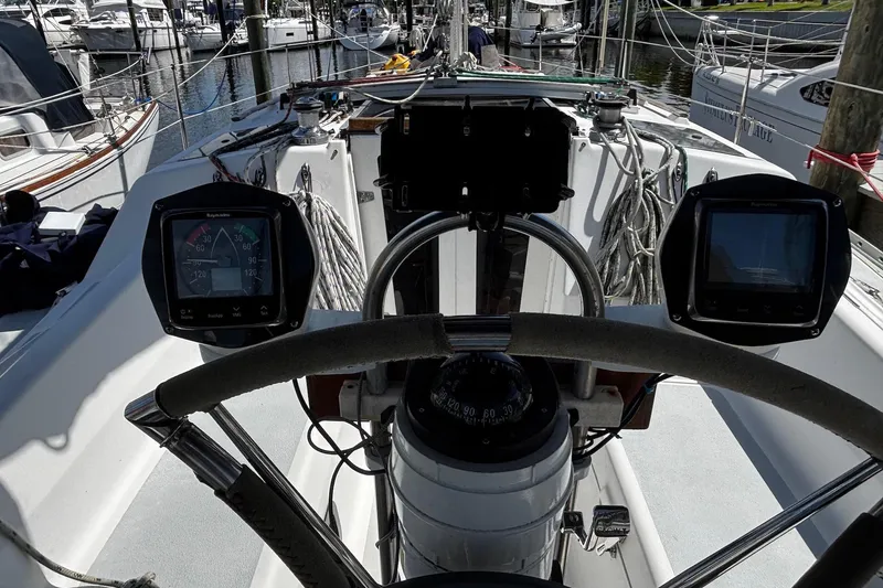 Slide: The Image of Cockpit view of a 1993 Hunter 33.5 sailboat with navigation instruments. - 8