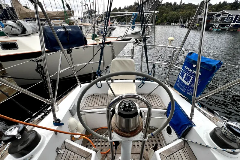 Slide: The Image of Cockpit of 1983 CT 38 Warwick sailboat with steering wheel and nautical equipment. - 6