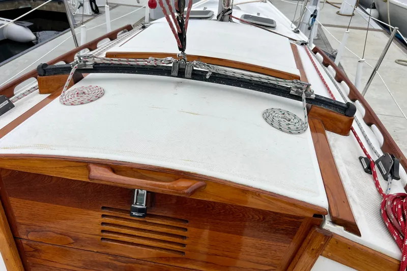 Slide: The Image of 1985 Catalina 27 sailboat deck with ropes and wooden hatch detail. - 10