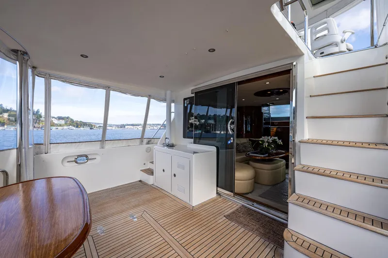 Slide: The Image of Luxurious 2009 Ocean Alexander 52 Sedan yacht interior with elegant seating and scenic water views. - 11