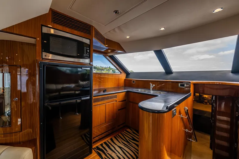 Slide: The Image of Luxurious kitchen interior of 2009 Ocean Alexander 52 Sedan yacht with modern appliances. - 27
