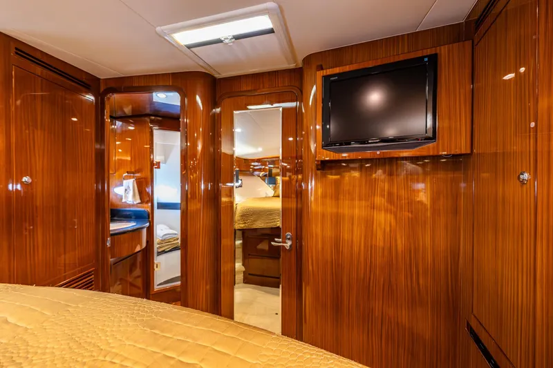 Slide: The Image of Luxurious interior of 2009 Ocean Alexander 52 Sedan yacht with wood paneling and mounted TV. - 33