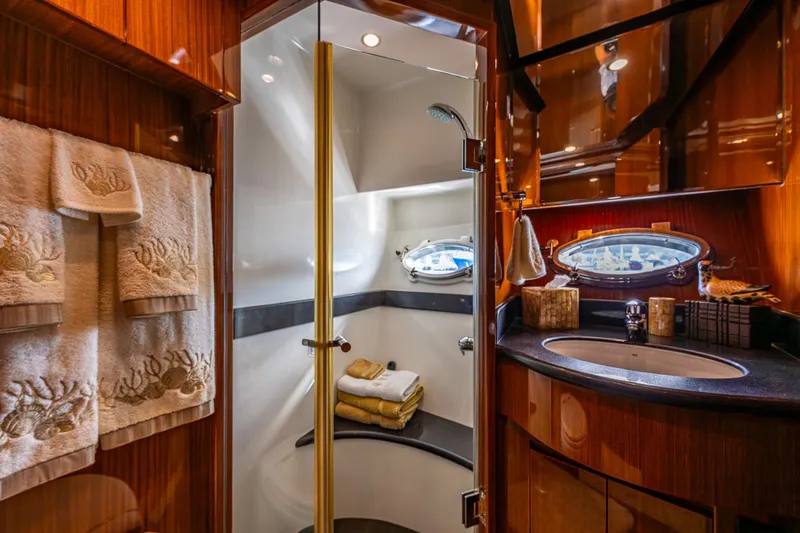 Slide: The Image of Luxurious bathroom in 2009 Ocean Alexander 52 Sedan yacht with elegant wood finishes. - 37
