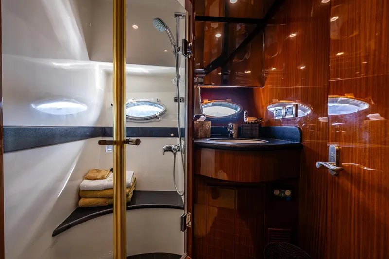 Slide: The Image of Luxurious bathroom in 2009 Ocean Alexander 52 Sedan yacht with wood accents and modern fixtures. - 38