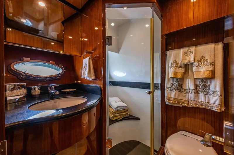 Slide: The Image of Luxurious bathroom in 2009 Ocean Alexander 52 Sedan yacht with elegant wood finishes. - 41