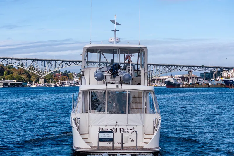 Slide: The Image of 2009 Ocean Alexander 52 Sedan yacht cruising towards bridge on a sunny day. - 8