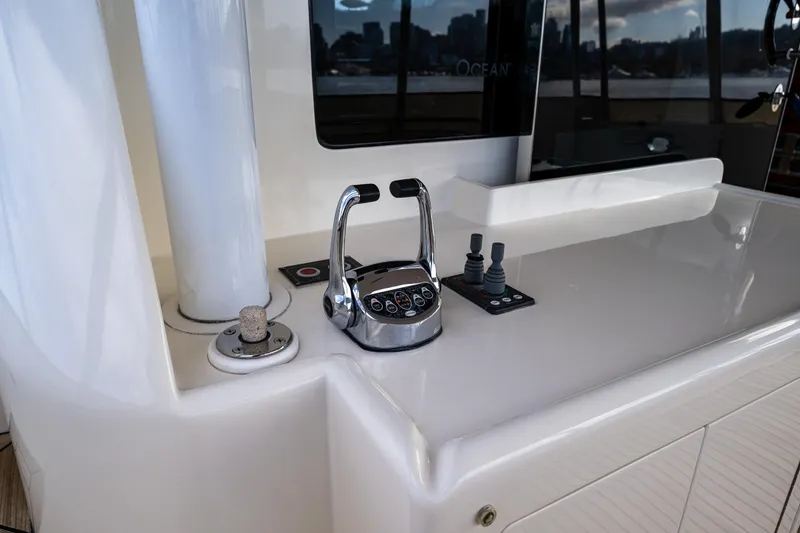 Slide: The Image of Aft deck control panel of 2009 Ocean Alexander 52 Sedan yacht with throttles and bow and stern thruster controls. - 9