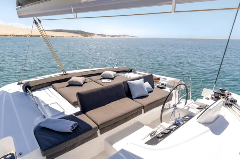 Slide: The Image of Luxurious 2026 Lagoon 46 yacht with spacious deck and comfortable seating on open water. - 11