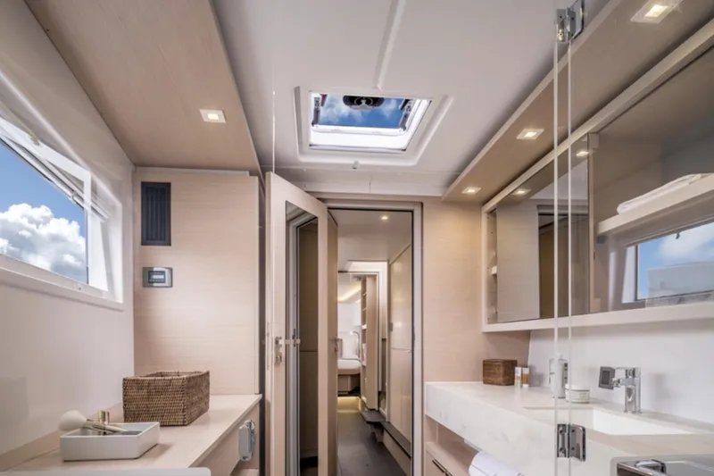 Slide: The Image of Luxurious interior of 2026 Lagoon 46 yacht bathroom with modern fixtures and natural lighting. - 4