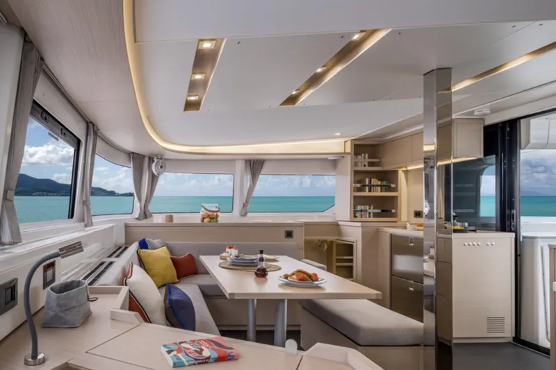 Slide: The Image of Luxurious interior of 2026 Lagoon 46 yacht with ocean view and modern furnishings. - 8