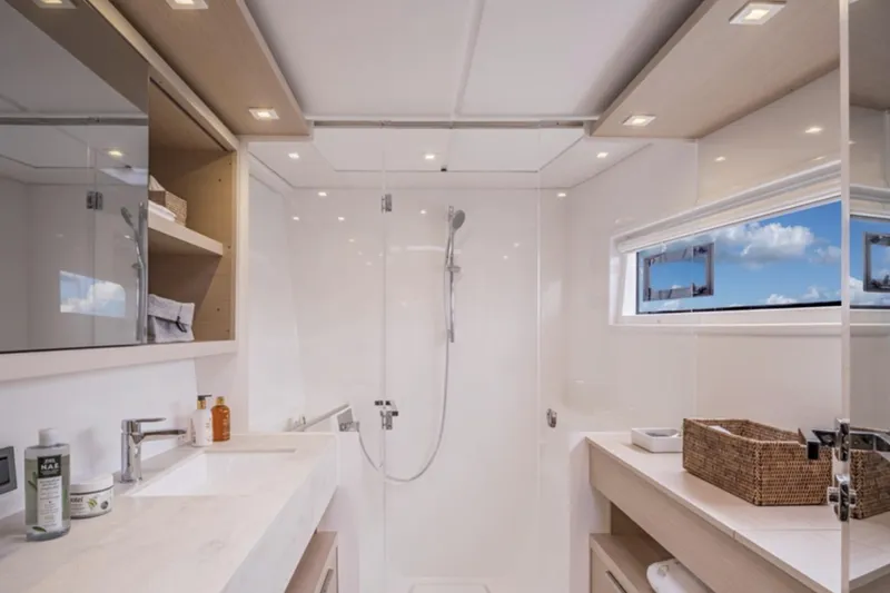 Slide: The Image of Luxurious bathroom in 2026 Lagoon 46 ICONIC yacht, featuring modern fixtures and ocean view. - 3