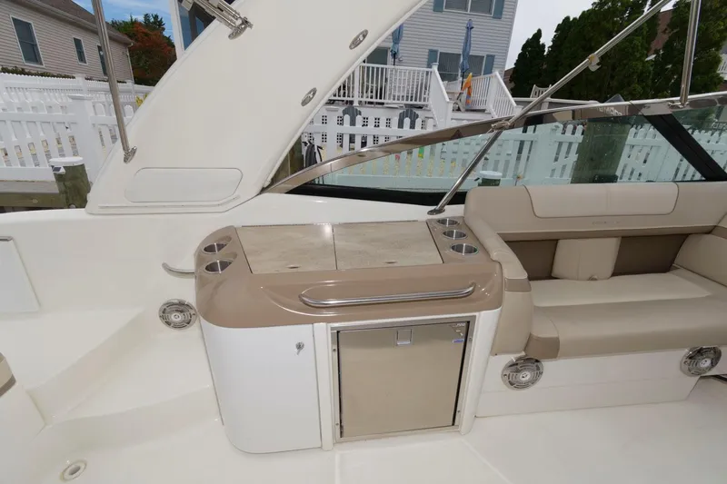 Slide: The Image of 2014 Formula 350 Crossover Bowrider interior with seating and storage area. - 12