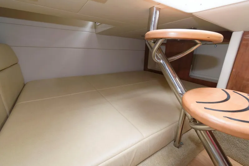 Slide: The Image of 2014 Formula 350 Crossover Bowrider cabin interior with seating and table. - 16