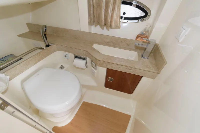 Slide: The Image of 2014 Formula 350 Crossover Bowrider bathroom with modern fixtures and compact design. - 18