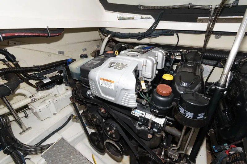 Slide: The Image of Engine compartment of a 2014 Formula 350 Crossover Bowrider, showcasing a V8 engine. - 20