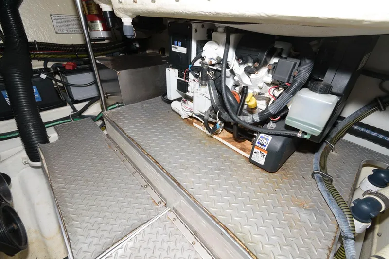 Slide: The Image of Engine compartment of a 2014 Formula 350 Crossover Bowrider with visible mechanical components. - 22