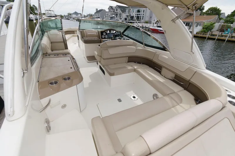 Slide: The Image of 2014 Formula 350 Crossover Bowrider interior with spacious seating and sleek design. - 3