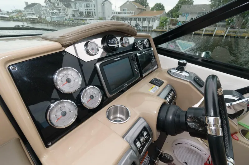 Slide: The Image of 2014 Formula 350 Crossover Bowrider dashboard with gauges and navigation system. - 7