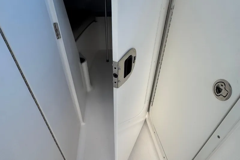 Slide: The Image of 2015 Pursuit DC 265 Dual Console interior cabin door detail. - 34