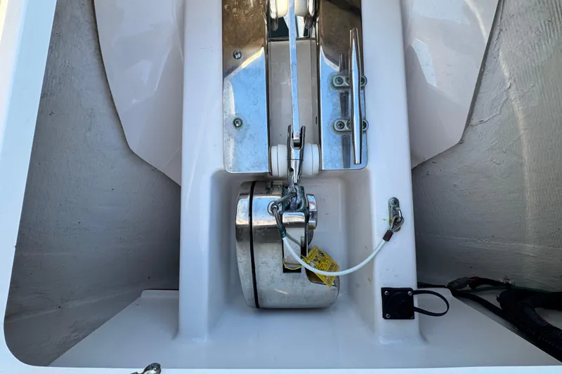 Slide: The Image of Anchor system of 2015 Pursuit DC 265 Dual Console boat, featuring stainless steel components. - 46