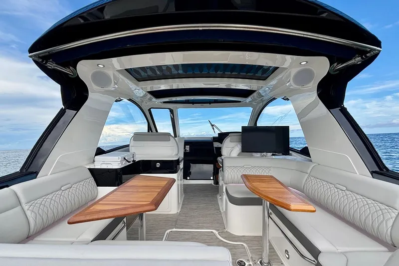 Slide: The Image of Luxurious interior of 2022 Sea Ray Sundancer 370 Outboard yacht with elegant seating and ocean view. - 11