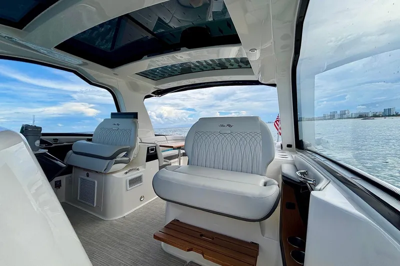Slide: The Image of Interior of 2022 Sea Ray Sundancer 370 Outboard with luxurious seating and ocean view. - 12