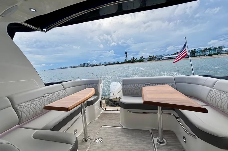 Slide: The Image of Luxury seating area on 2022 Sea Ray Sundancer 370 Outboard with ocean view. - 15