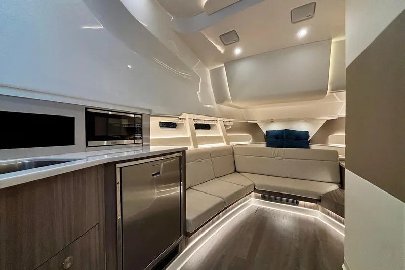 Slide: The Image of Luxurious interior of 2022 Sea Ray Sundancer 370 Outboard with modern seating and kitchen amenities. - 16