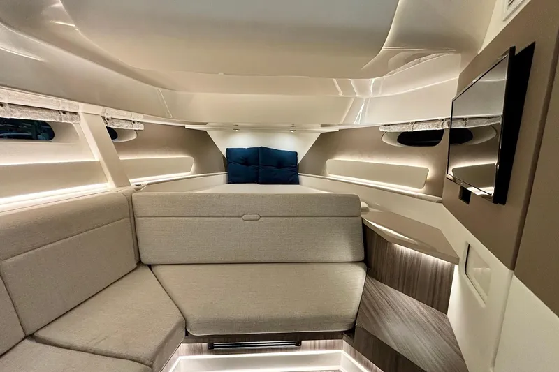 Slide: The Image of Luxurious interior of 2022 Sea Ray Sundancer 370 Outboard with modern seating and ambient lighting. - 17