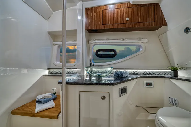 Slide: The Image of Manufacturer Provided Image: Luxurious bathroom in 2022 Sea Ray Sundancer 370 OB yacht with modern fixtures. - 18