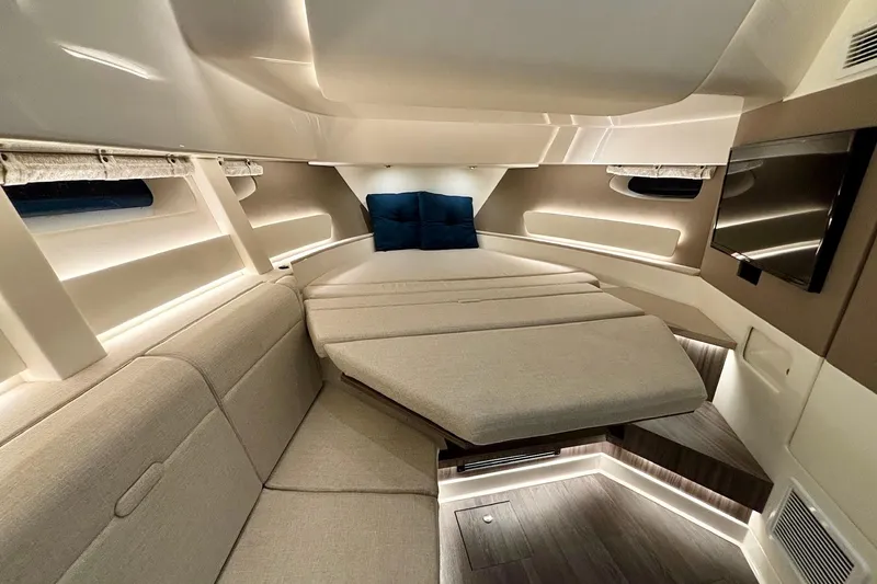 Slide: The Image of Luxurious interior of 2022 Sea Ray Sundancer 370 Outboard with modern seating and ambient lighting. - 19